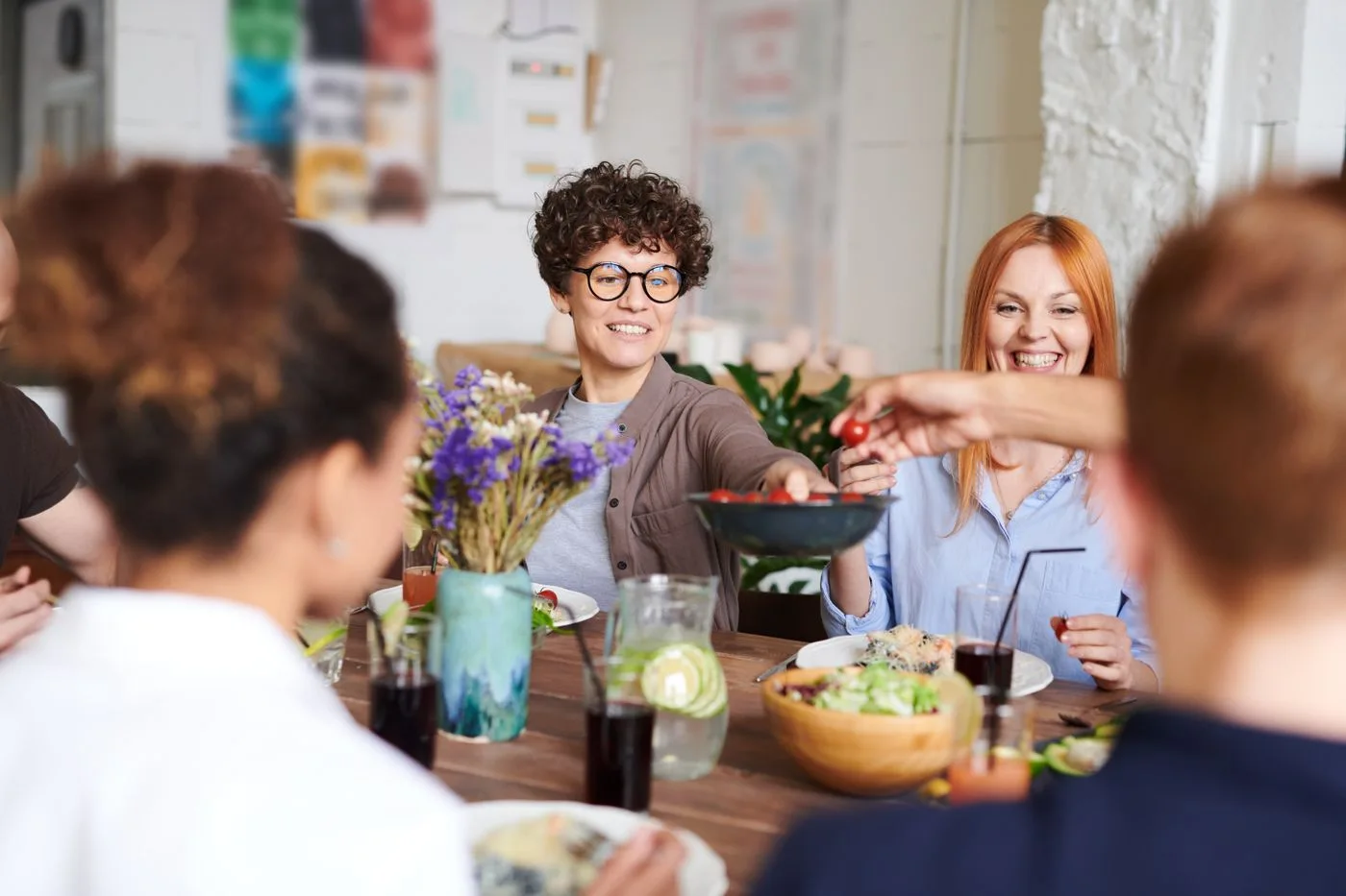 Friends sharing a meal and conversation around a table